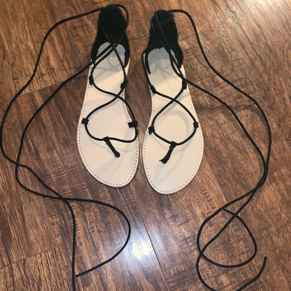 Lace up black gladiator sandals